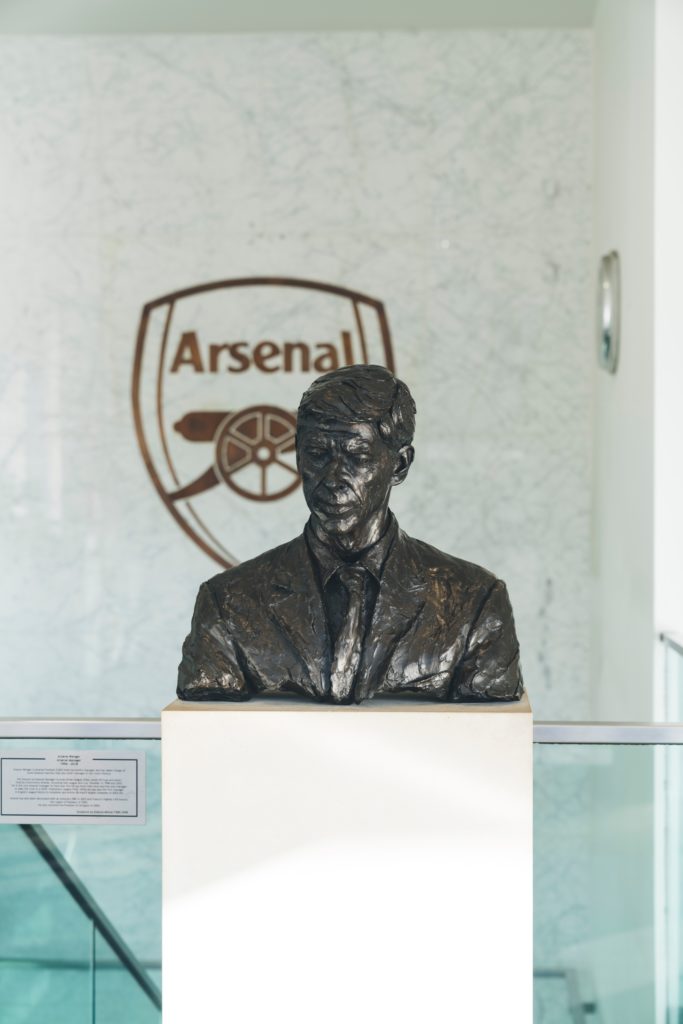 Statue of Arsène Wenger, former Arsenal manager, known for his innovative leadership in football.